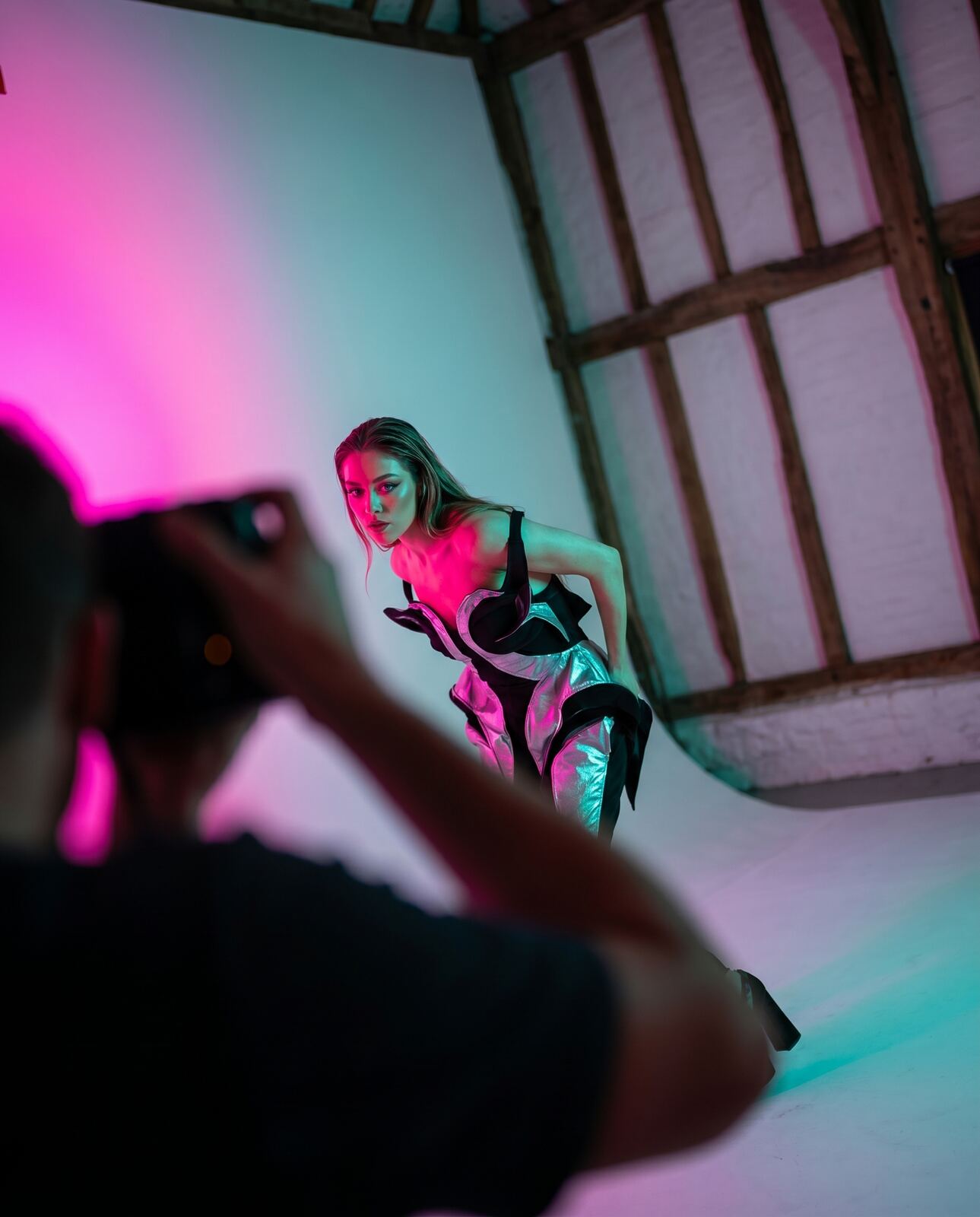 Fashion model under colour gels in the studio