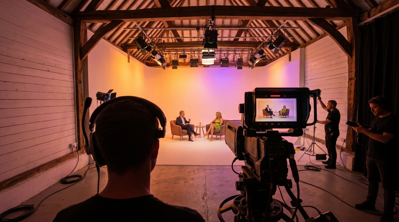 Presenter filmed over the shoulder for a live stream